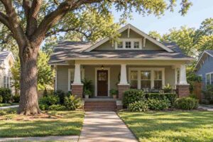 Well-maintained Craftsman bungalow with a covered porch and shingled roof, illustrating older home insurance.