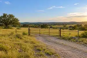 Vacant land insurance in Texas for an undeveloped parcel with a gated entrance